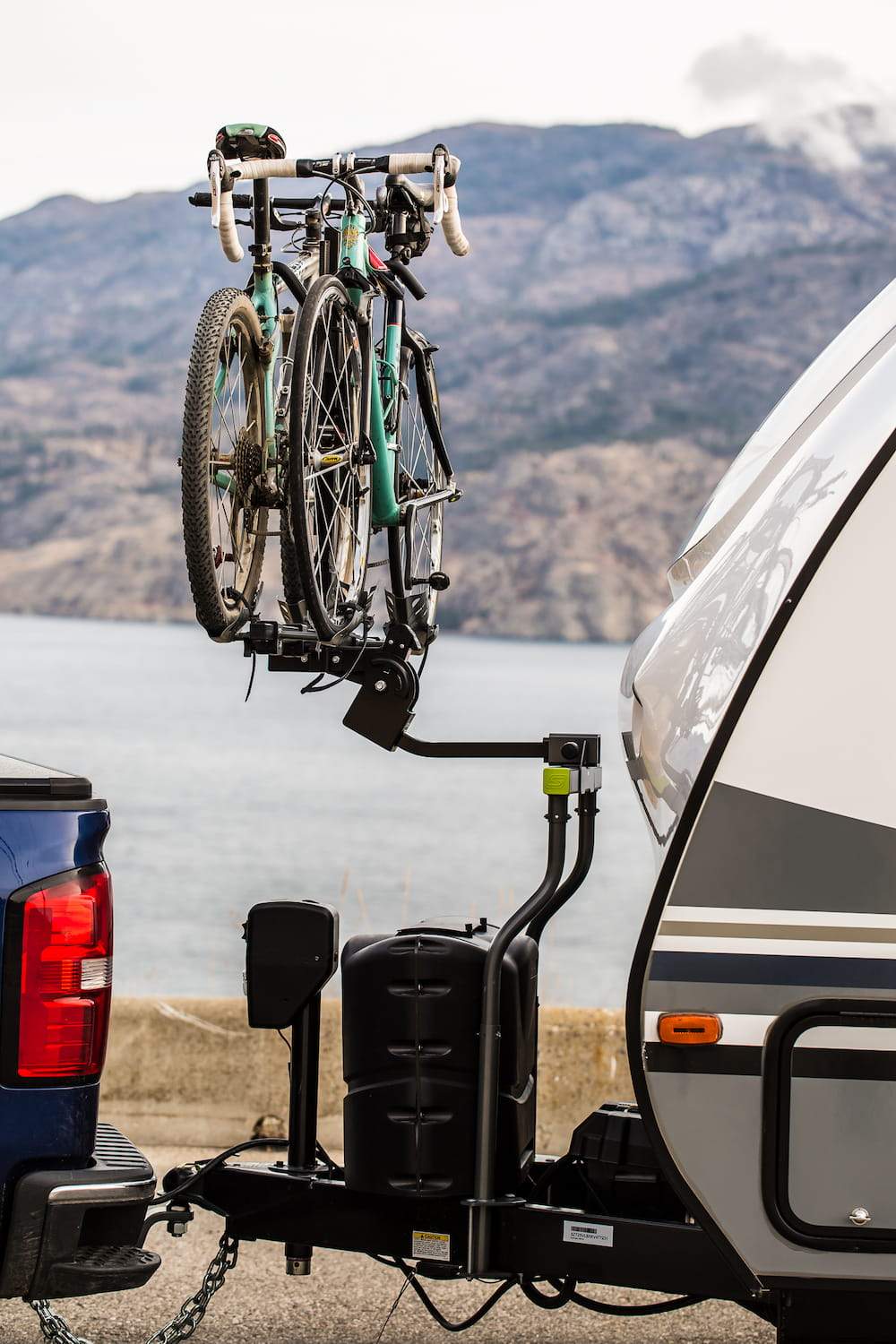 Bike rack between car and trailer on sale